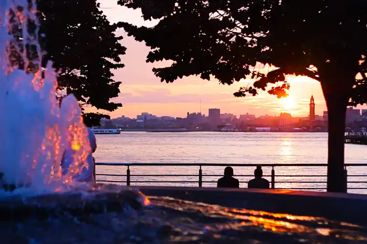 two people looking over the river in relaxation mode