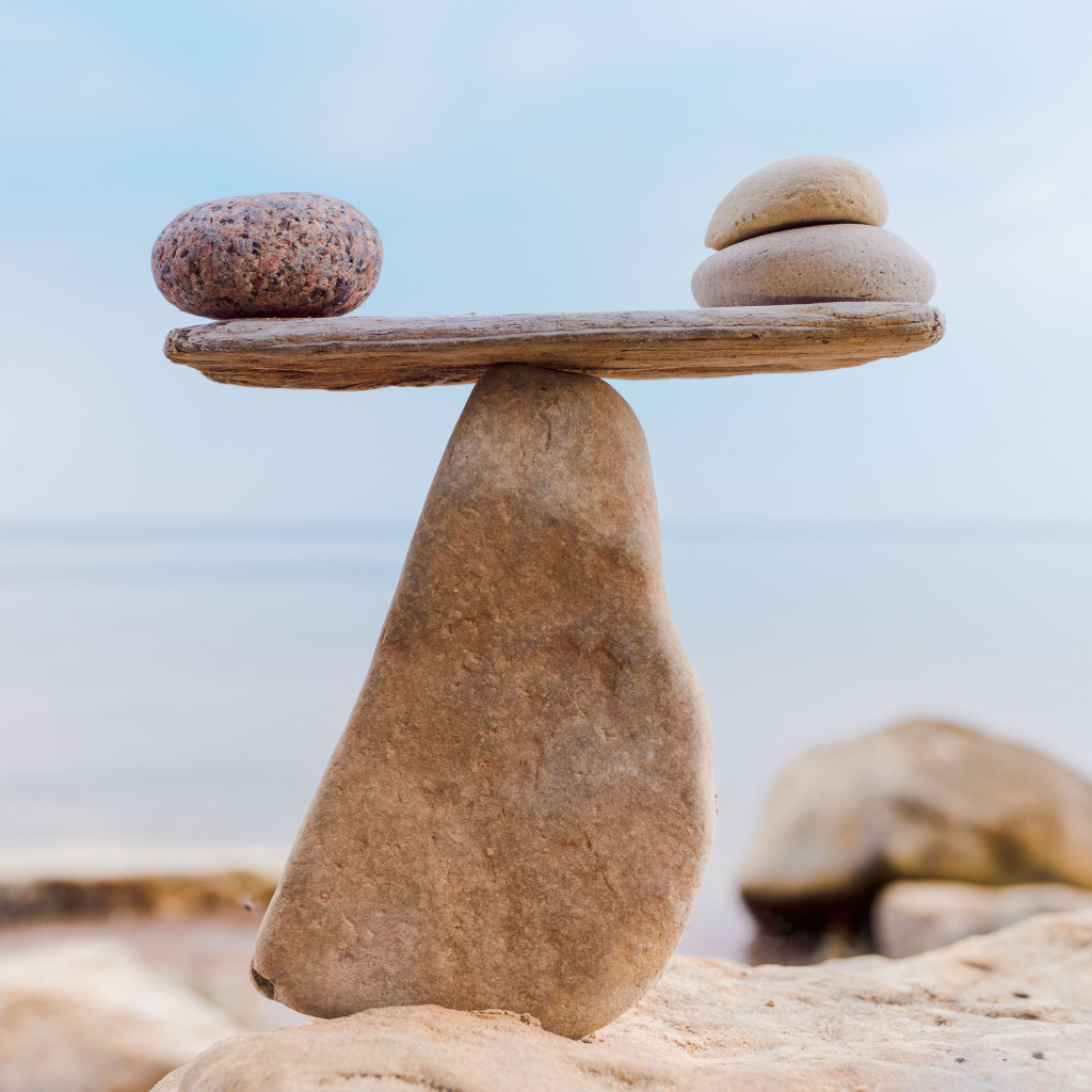 rocks balanced on beach